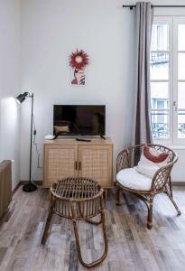 Télévision ou salle de divertissement dans l'établissement Résidence Aristide Briand - Appartements en Centre Ville
