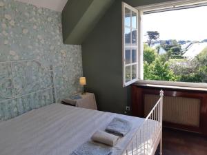 Posteľ alebo postele v izbe v ubytovaní Maison bord de mer