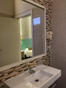 Koupelna v ubytování Ouril Pontao Hotel + 37 fotografií
