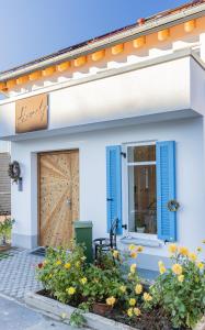 a house with blue shutters and a door at Homely in Heidenheim