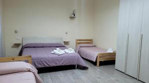 Postel nebo postele na pokoji v ubytování Binario176