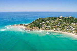 an aerial view of a small island in the ocean at Retreat at Byron in Byron Bay
