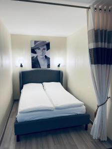 Postel nebo postele na pokoji v ubytování Daukantas Studio