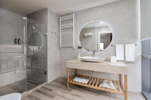 a bathroom with a sink and a shower at Gudauri Lodge in Gudauri