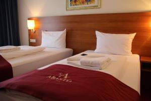 Postel nebo postele na pokoji v ubytování Abasto Hotel Eichenau