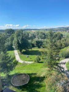 an overhead view of a field with trees and a road at Apartament Na Skarpie in Nowy Targ