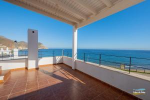 a balcony with a view of the ocean at Calilla de San José in San José +10 photos