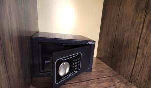 a microwave oven with its door open in a room at EVN Boutique Hotel in Yerevan