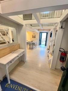 a living room with a table and a mirror at La dimora sul porto in Termoli