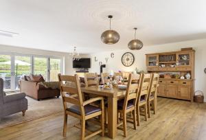 a dining room and living room with a table and chairs at The Garden Apartment a luxurious Rural Retreat in Wellington