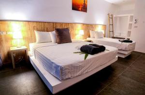 Postel nebo postele na pokoji v ubytování The Cosy Maenam Beach Resort + 37 fotografií