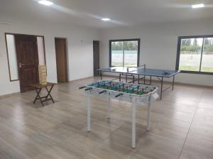 a room with two tables with stained glass at Buenas Tierras Cabañas in San Rafael