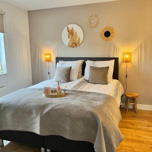 a bedroom with a large bed with a tray on it at Bed and Breakfast De Beekhoek in Glane