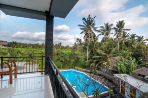 a view from the balcony of a resort with a swimming pool at Gita Maha Ubud Hotel by Mahaputra-CHSE Certified in Ubud