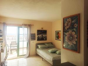 A bed or beds in a room at Caleta Paraiso 127