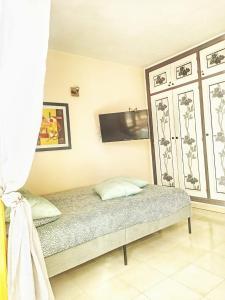 A bed or beds in a room at Caleta Paraiso 127