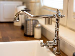 a kitchen sink with a silver faucet at Holiday Bay in Władysławowo