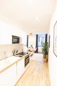 Kuchyňa alebo kuchynka v ubytovaní Luz - Appartement hyper centre Saint-Etienne