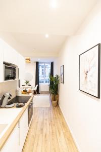 Televízia a/alebo spoločenská miestnosť v ubytovaní Luz - Appartement hyper centre Saint-Etienne