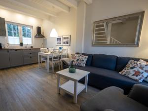 a living room with a couch and a table at Holiday Bay in Władysławowo