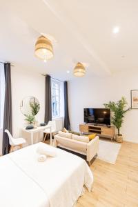 Televízia a/alebo spoločenská miestnosť v ubytovaní Luz - Appartement hyper centre Saint-Etienne