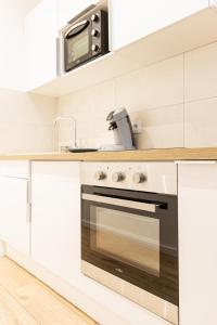 Kuchyňa alebo kuchynka v ubytovaní Luz - Appartement hyper centre Saint-Etienne