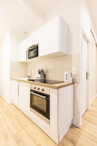 Kuchyňa alebo kuchynka v ubytovaní Luz - Appartement hyper centre Saint-Etienne