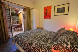 A bed or beds in a room at Vatu Sanctuary