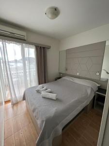 Postel nebo postele na pokoji v ubytování Apartments Villa Simoni