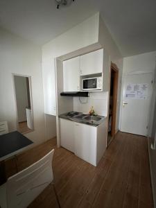 Kuchyň nebo kuchyňský kout v ubytování Apartments Villa Simoni