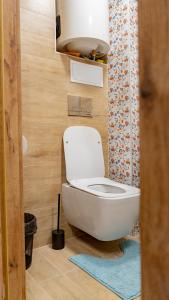 a bathroom with a white toilet in a room at 1bdr flat close to the center in Stara Zagora