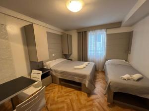 Postel nebo postele na pokoji v ubytování Apartments Villa Simoni