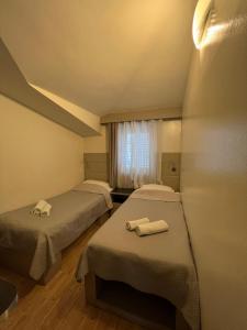 Postel nebo postele na pokoji v ubytování Apartments Villa Simoni