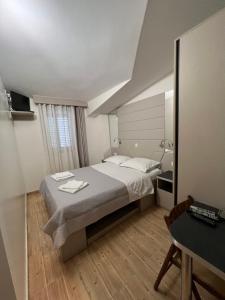 Postel nebo postele na pokoji v ubytování Apartments Villa Simoni