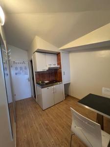 Kuchyň nebo kuchyňský kout v ubytování Apartments Villa Simoni