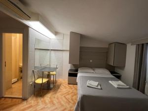 Postel nebo postele na pokoji v ubytování Apartments Villa Simoni
