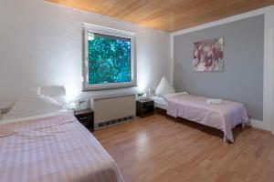 Postel nebo postele na pokoji v ubytování Appartement-Marienrode