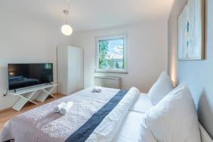 TV a/nebo společenská místnost v ubytování Appartement-Marienrode
