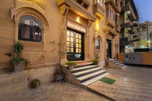 a building with stairs in front of a store at Hotel Akashdeep - Located City Centre in Jaisalmer