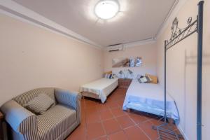 Postel nebo postele na pokoji v ubytování Casa del Geco - La natura intorno a te