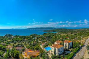 an aerial view of a villa with the ocean at Villa Thalia Floating Heaven in Porto Heli