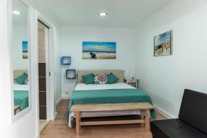 Un pat sau paturi într-o cameră la Casa Luz