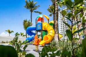 a playground with a water slide in front of a building at SALINAS PREMIUM RESORT in Salinópolis