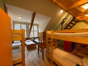 A bed or beds in a room at Středisko ekologické výchovy SEVER