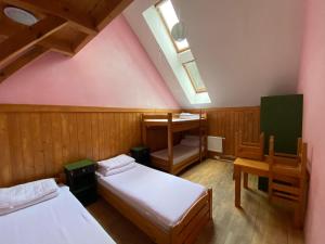 A bed or beds in a room at Středisko ekologické výchovy SEVER
