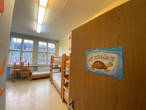 A bed or beds in a room at Středisko ekologické výchovy SEVER