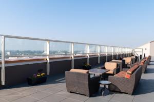 a row of chairs and tables on a balcony at WorldMark Anaheim in Anaheim