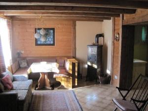 a living room with a couch and a table at Knusperhäusle Reckenberg in Bad Hindelang