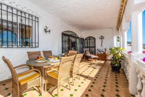 Posedenie v ubytovaní Villa Las Lilas