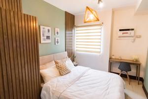 En eller flere senge i et værelse på Grand Residences Cebu ETB - Near IT Park and Ayala Cebu